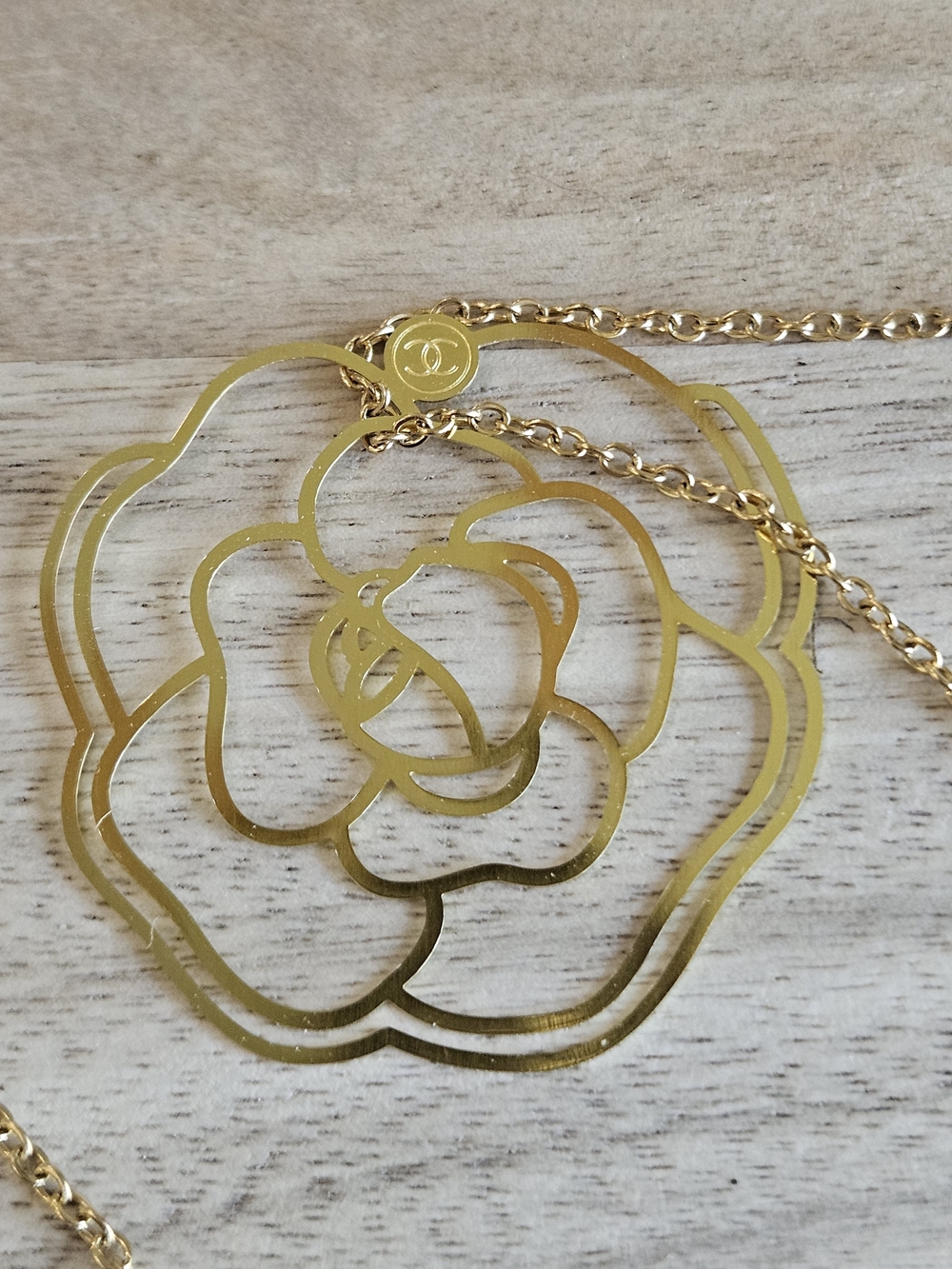 CHANEL Gold Camellia Bookmark- Elegant Branded Accent